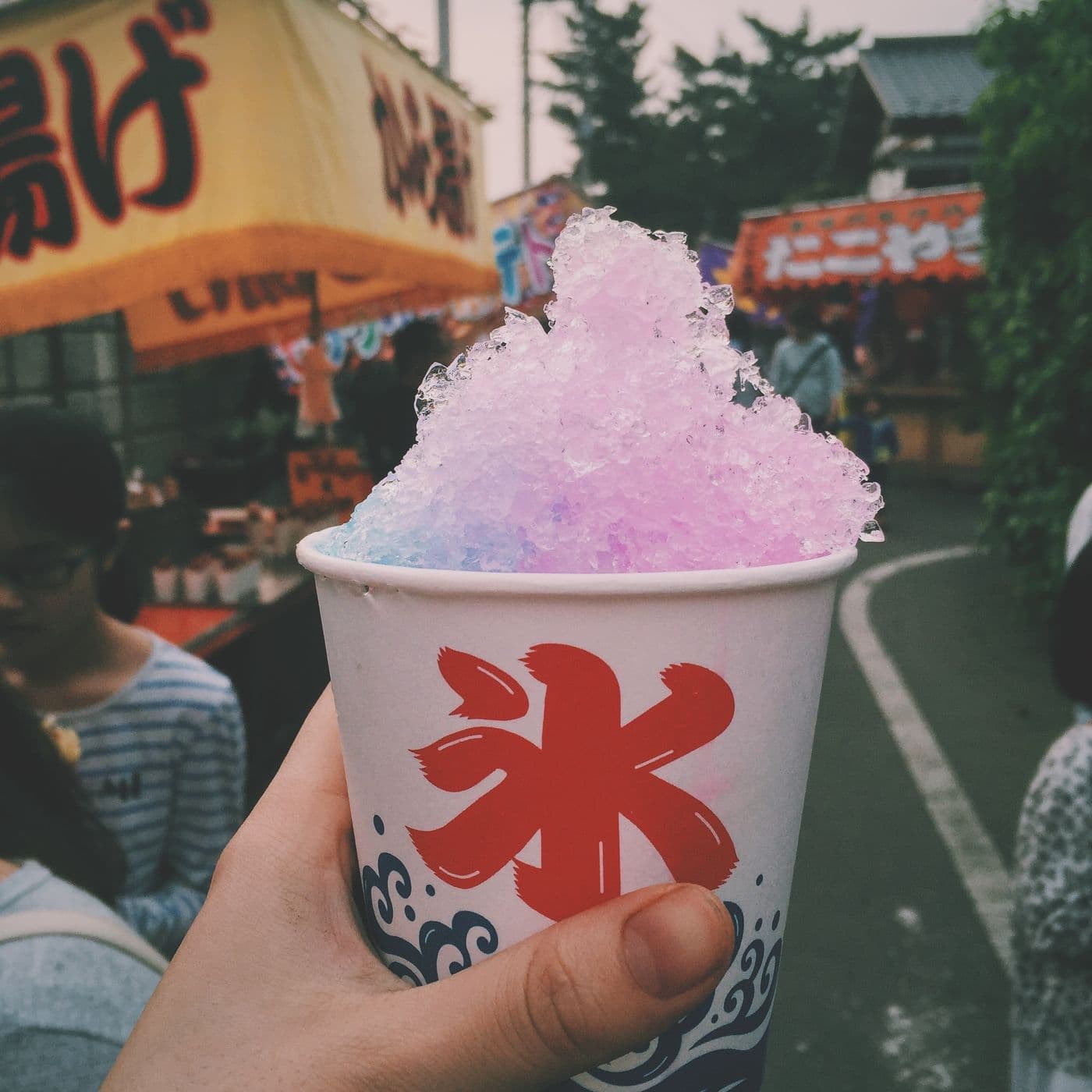 A colorful red and yellow snow cone